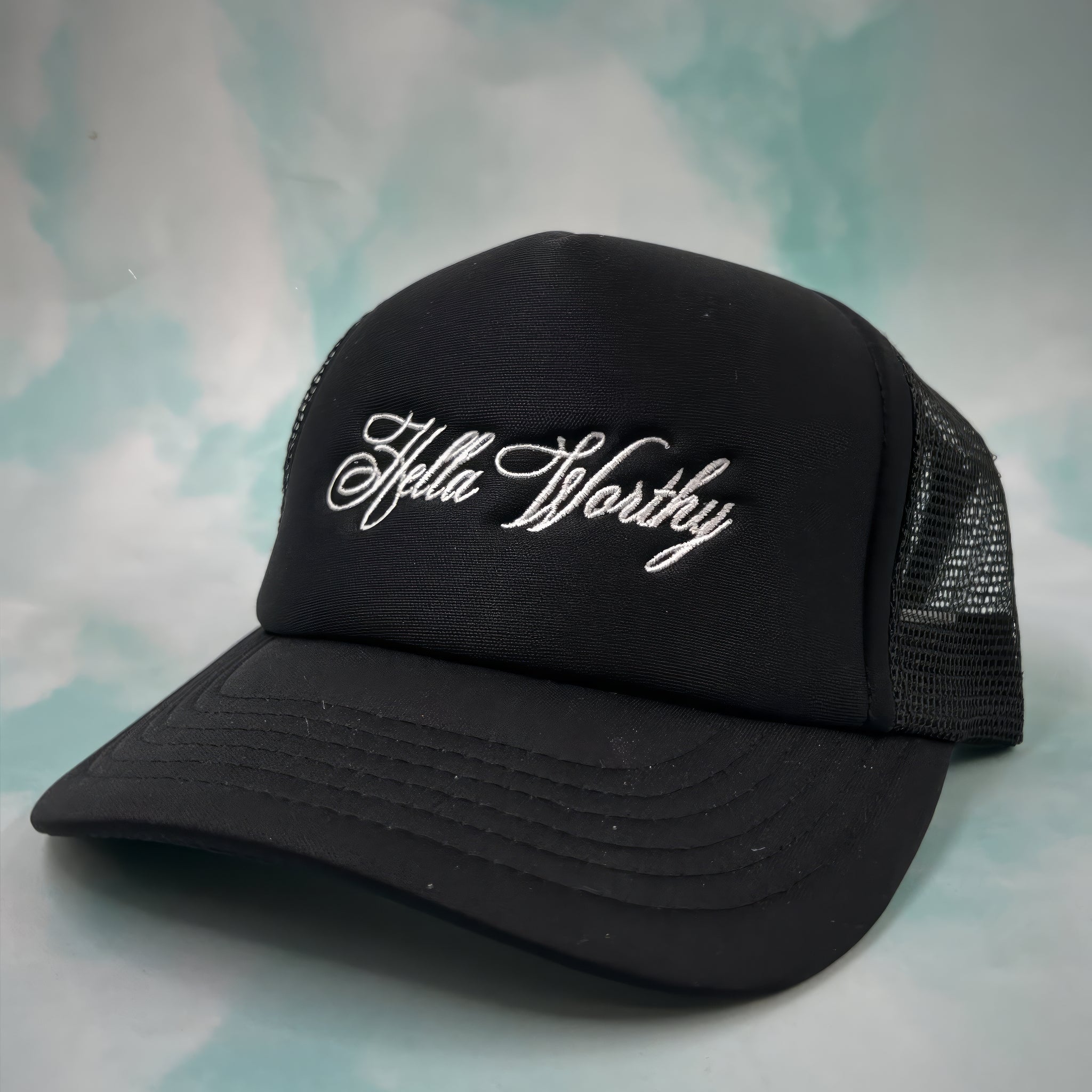 BLACK HELLA WORTHY TRUCKER HAT