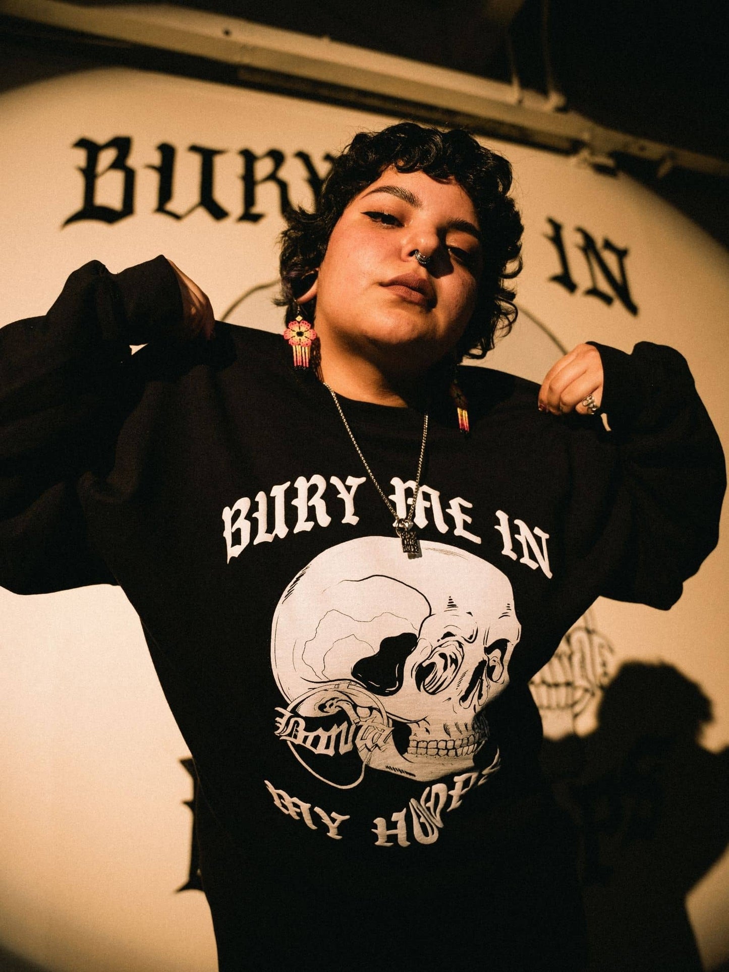 Viva La Bonita black Bury me in my hoops crewneck sweatshirt. Model showing front of Viva la Bonita women streetwear sweatshirt.